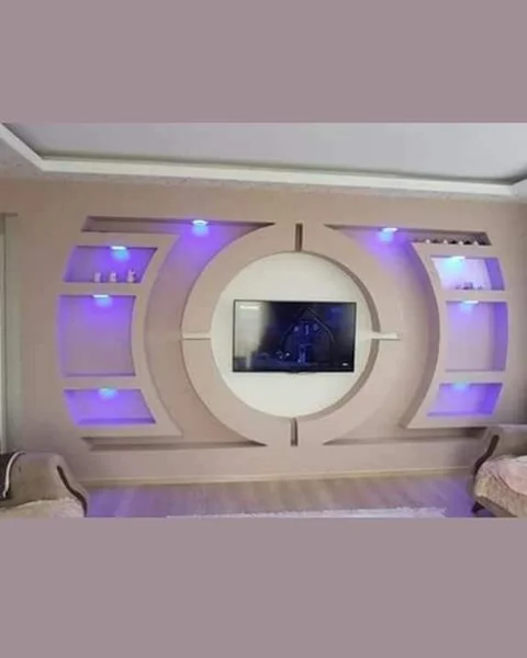 Custom TV wall unit installation in Algarve with LED lighting, built-in shelving and modern design